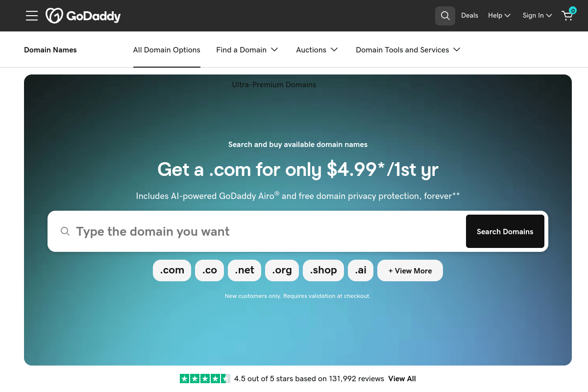 GoDaddy domain registration page showing domain search with promotional first-year pricing